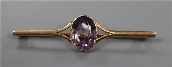 A 15ct and amethyst set bar brooch, 63mm.